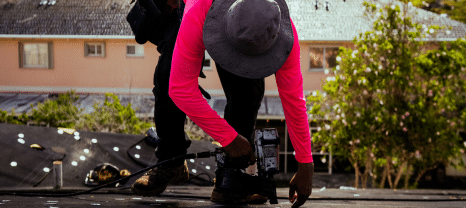 Roofer gunning the roof